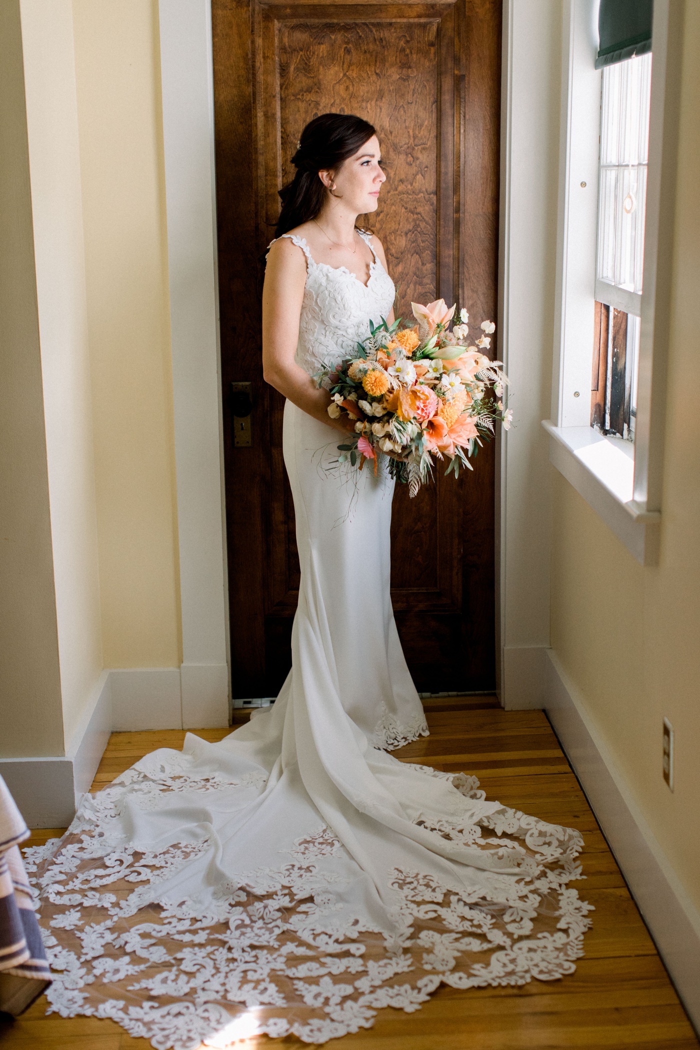 Bride in a wedding gown with lace detail and a mermaid skirt