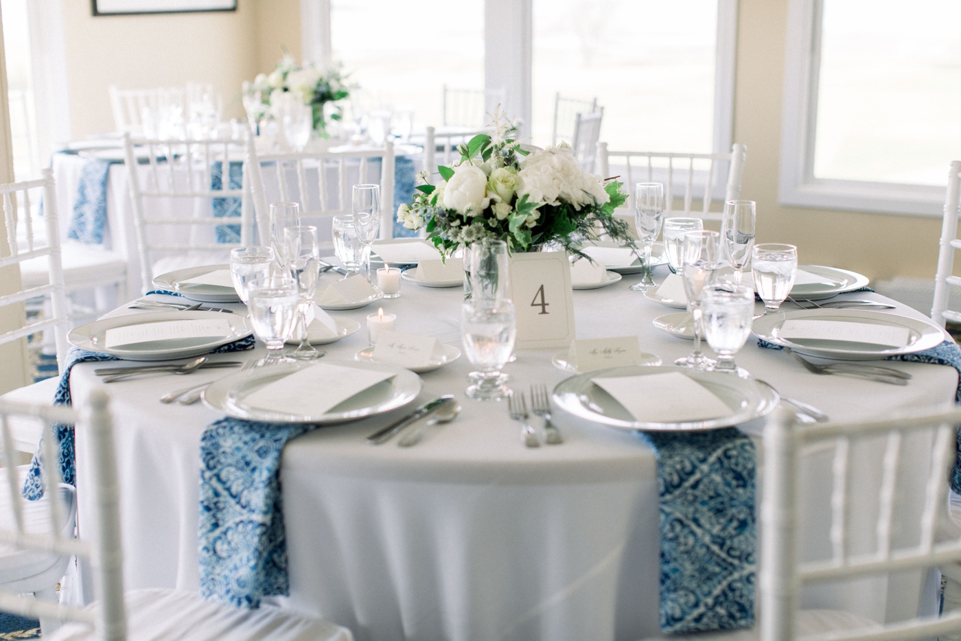 Blue and white linens for a classic wedding reception at Hatherly Country Club