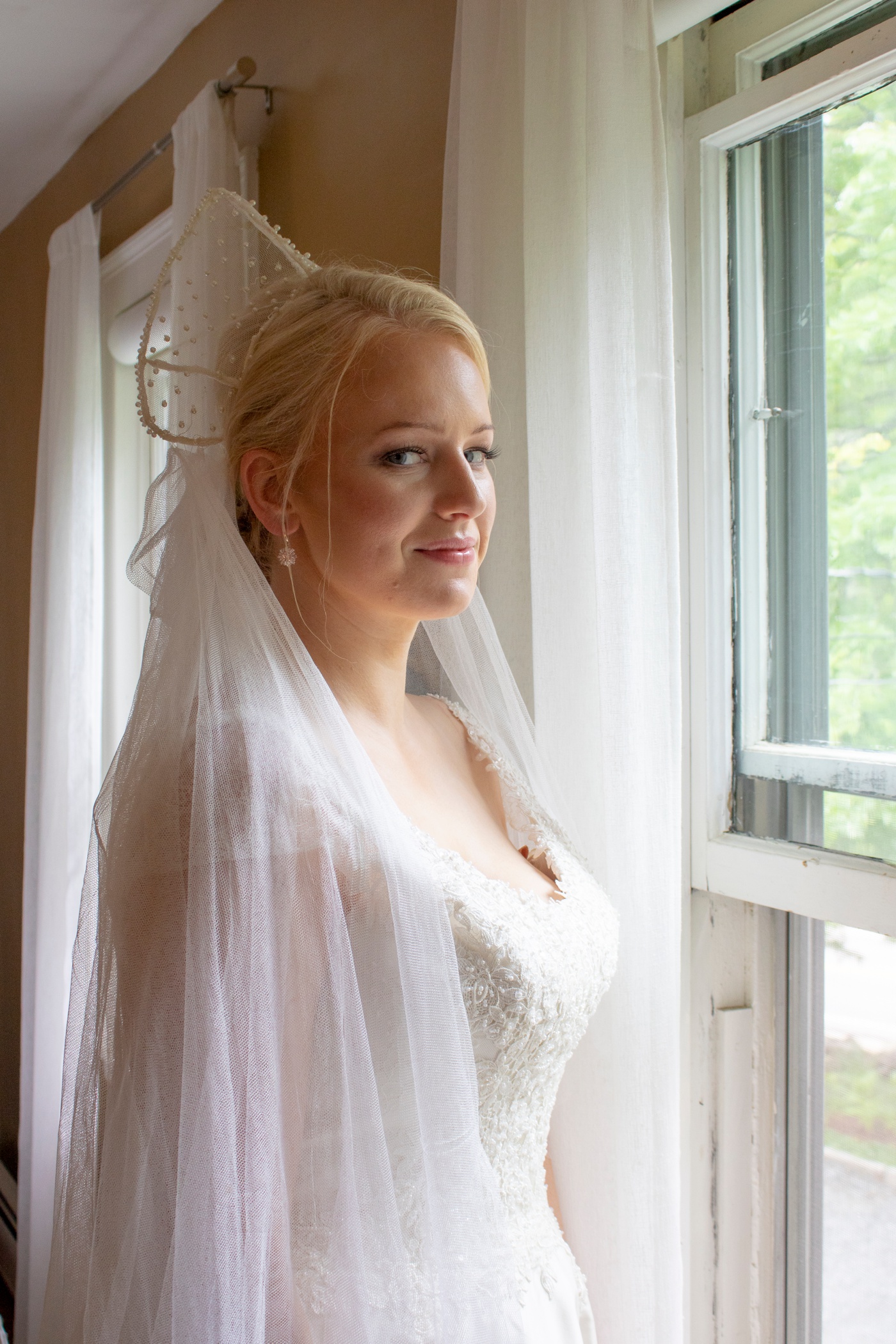 Bride getting ready at her family home in New England
