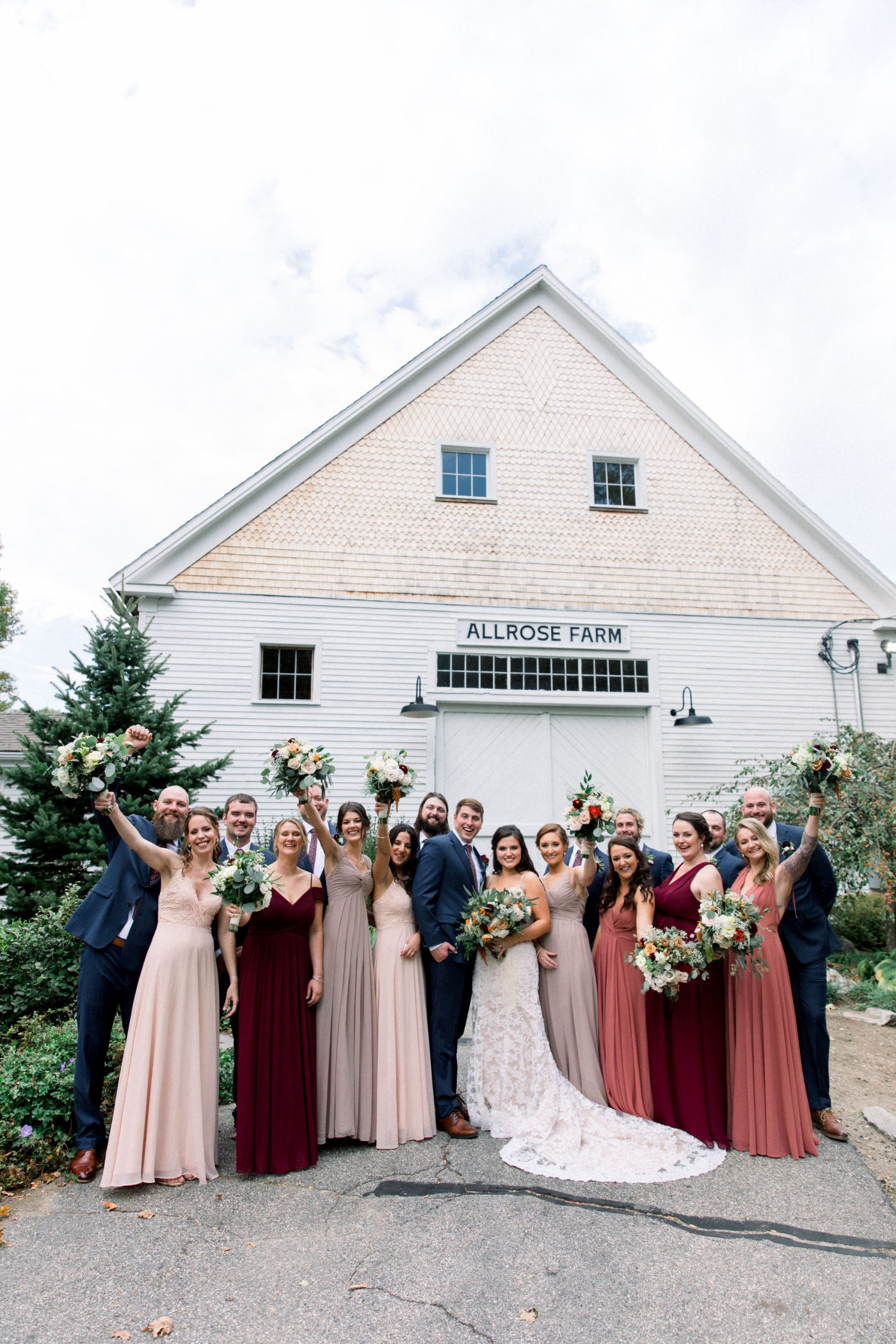 blush, red, and burgundy bridesmaids dresses