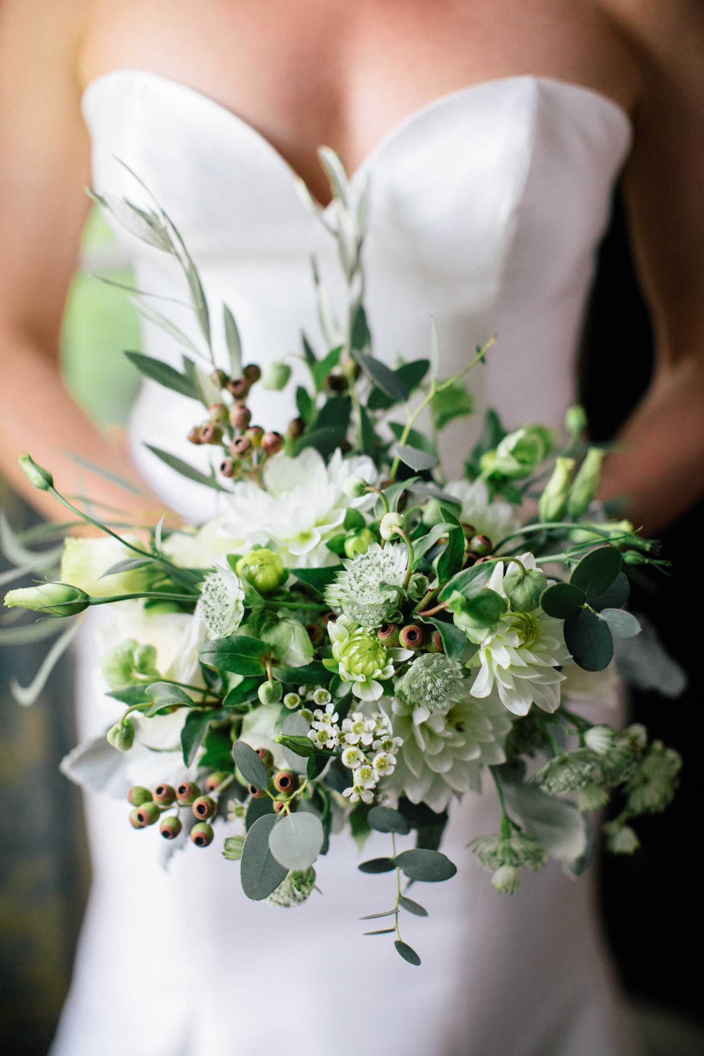 Green and white wedding bouquet filled with dahlias and astrantia by Posies by Trim