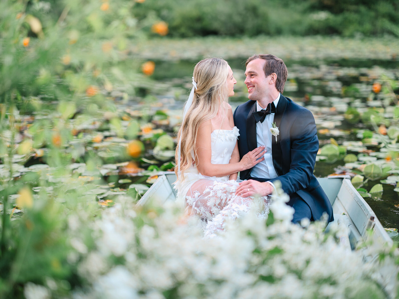 Nicole and Andrew’s wedding golden hour row boat ride at OQ Farm